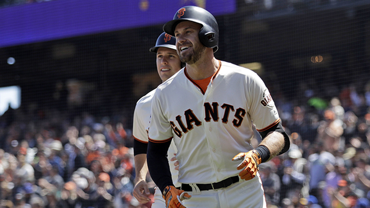 San Francisco Giants' Evan Longoria, right, smiles in front of teammate Buster Posey after Longoria's three-run home run during the first inning of a baseball game against the Los Angeles Dodgers Sunday, April 29, 2018, in San Francisco. (AP Photo/Marcio Jose Sanchez)