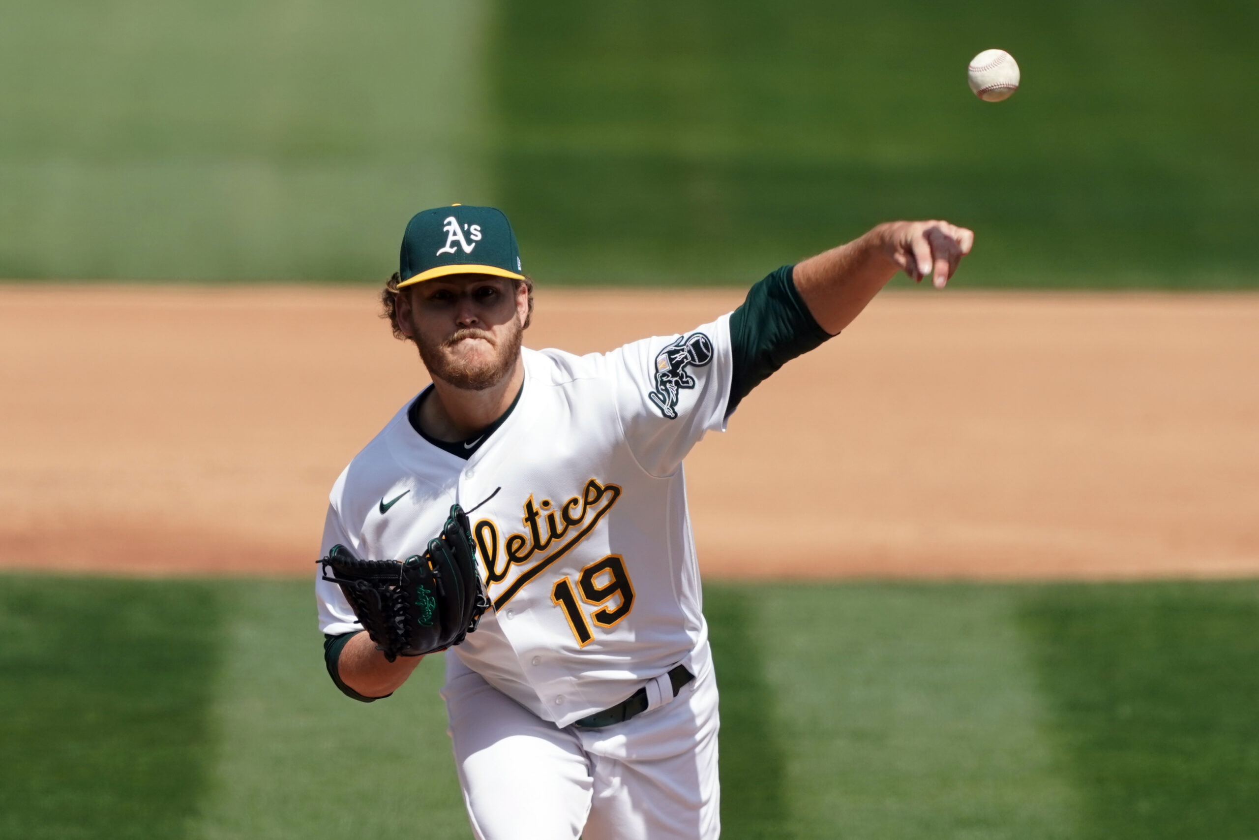 Apr 3, 2021; Oakland, California, USA; Oakland Athletics starting pitcher Cole Irvin (19) throws a pitch during the fourth inning against the Houston Astros at RingCentral Coliseum. Mandatory Credit: Darren Yamashita-USA TODAY Sports