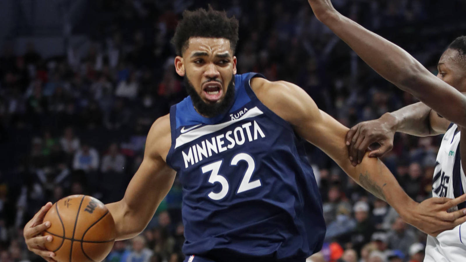 Dec 19, 2021; Minneapolis, Minnesota, USA; Minnesota Timberwolves center Karl-Anthony Towns (32) works towards the basket around Dallas Mavericks forward Dorian Finney-Smith (10) in the third quarter at Target Center. Mandatory Credit: Bruce Kluckhohn-USA TODAY Sports