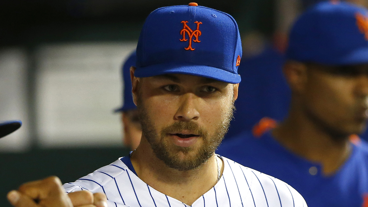 New York Mets starting pitcher Tylor Megill is greeted in the dugout after leaving game against the Atlanta Braves during the fifth inning of a baseball game Wednesday, June 23, 2021, in New York. (AP Photo/Noah K. Murray)