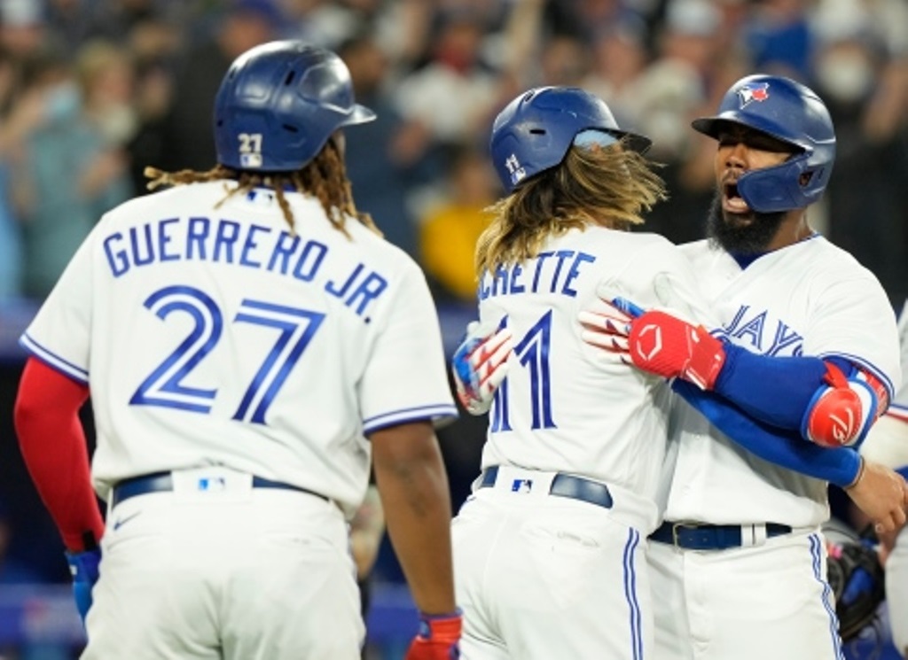Los Azulejos de Toronto celebran, The Canadian Press