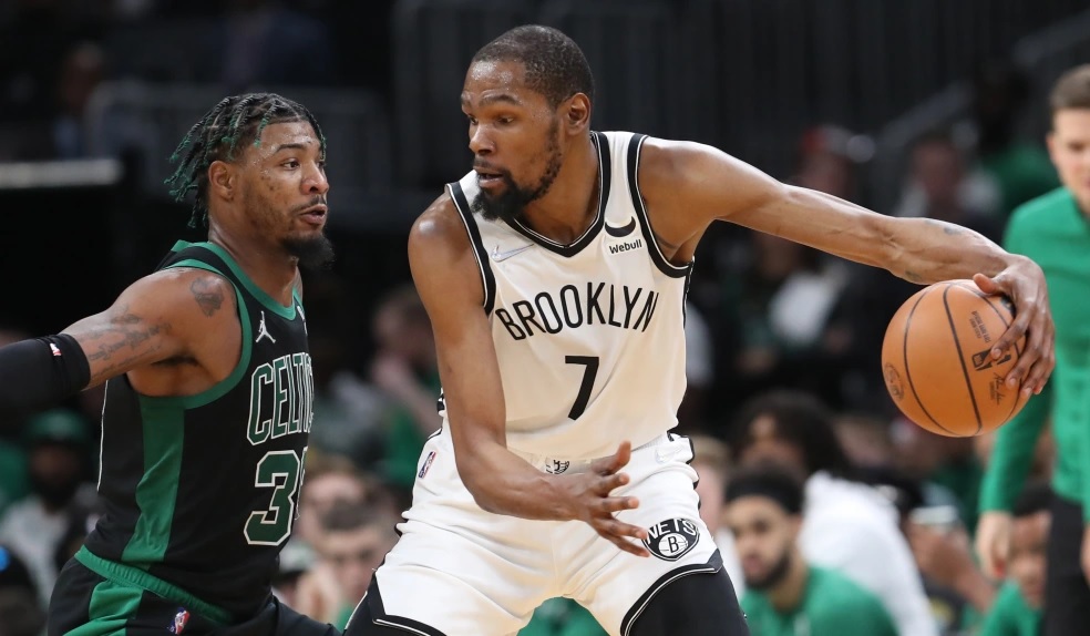 Brooklyn Nets forward Kevin Durant drives past Boston Celtics guard Marcus Smart during the 3rd quarter of the first round of the Eastern Conference playoffs at the TD Garden on April 17, 2022 in Boston, MA. (Staff Photo By Nancy Lane/MediaNews Group/Boston Herald)