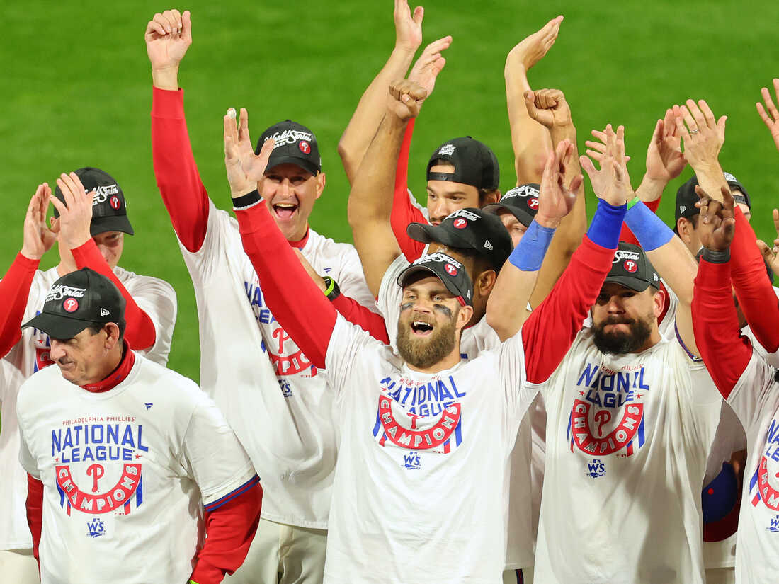 PHILADELPHIA, PENNSYLVANIA - OCTOBER 23: Bryce Harper #3 of the Philadelphia Phillies celebrates with teammates after defeating the San Diego Padres in game five to win the National League Championship Series at Citizens Bank Park on October 23, 2022 in Philadelphia, Pennsylvania. (Photo by Michael Reaves/Getty Images)