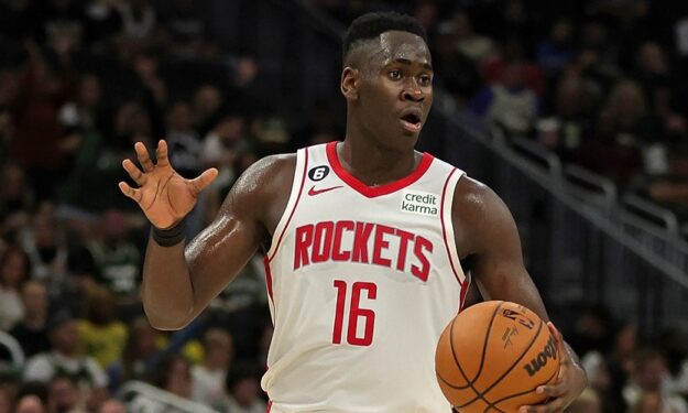 MILWAUKEE, WISCONSIN - OCTOBER 22: Usman Garuba #16 of the Houston Rockets handles the ball during a game against the Milwaukee Bucks at Fiserv Forum on October 22, 2022 in Milwaukee, Wisconsin. NOTE TO USER: User expressly acknowledges and agrees that, by downloading and or using this photograph, User is consenting to the terms and conditions of the Getty Images License Agreement. (Photo by Stacy Revere/Getty Images)