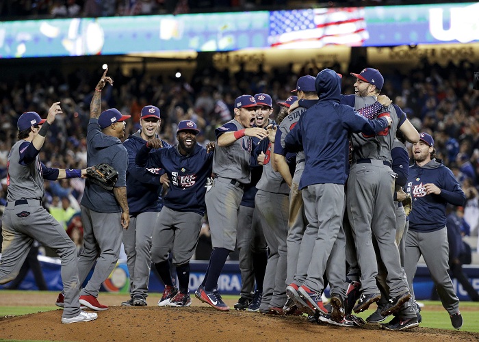 The U.S. team celebrate an 8-0 win over Puerto Rico in the final of the World Baseball Classic in Los Angeles, Wednesday, March 22, 2017. (AP Photo/Jae C. Hong)